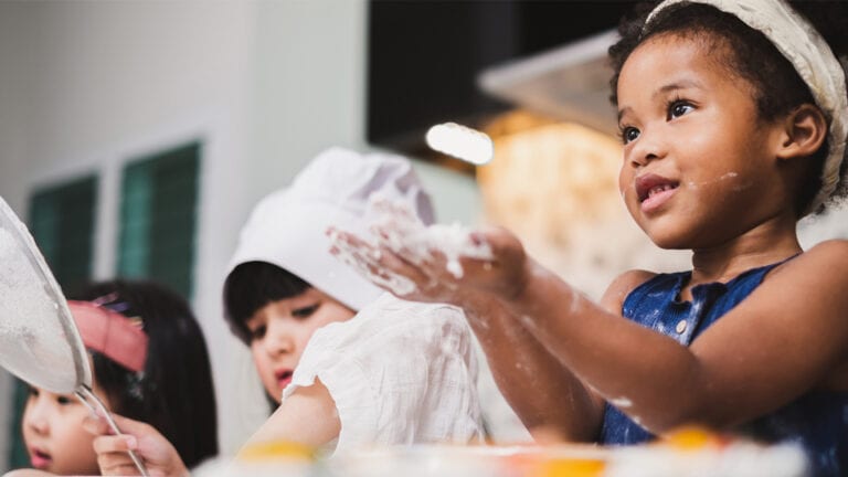 Youth children backing and offering to share ingredients. .