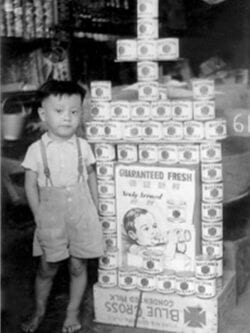 Young kid with cans.