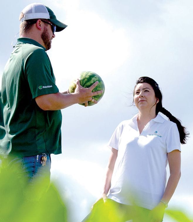 Agronomist with watermelon.