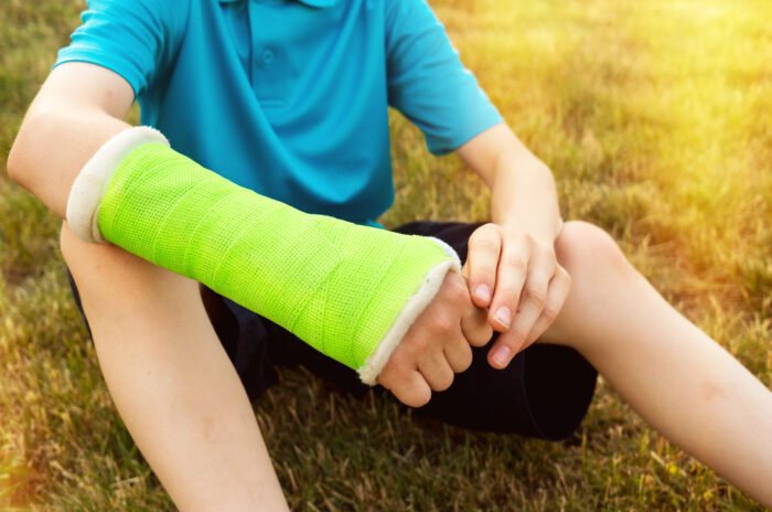 Young boy with his arm in a cast