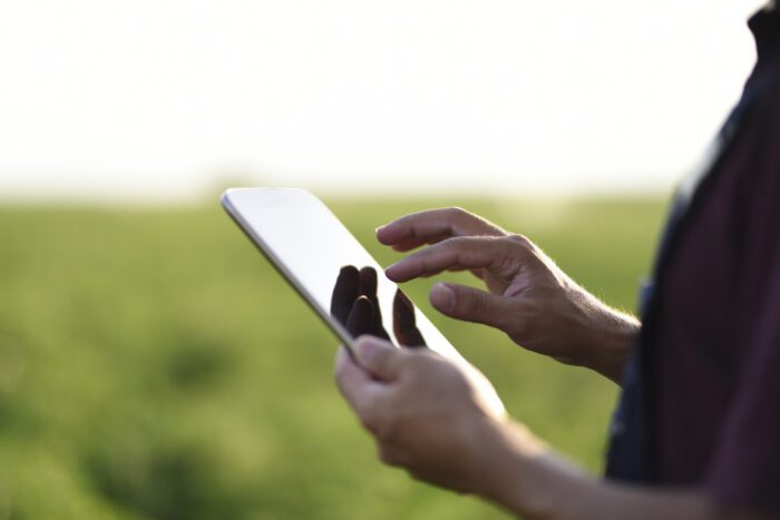 Young Farmer using a digital tablet. Technology is key to increasing agriculture productivity